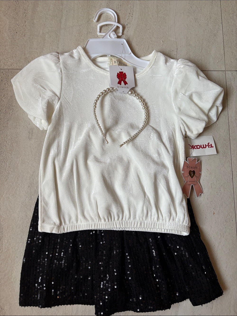 btween White Puff-Sleeve Top with Black Sequin Skirt and Pearl Headband